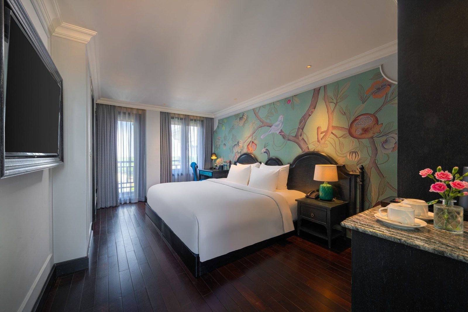 Hotel room in Hoi An with a desk by the window