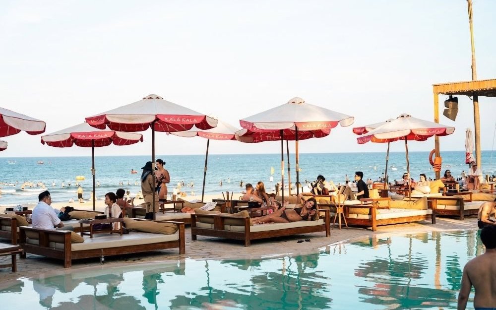 Beach club with a pool, sun loungers and umbrellas on the Da Nang coast